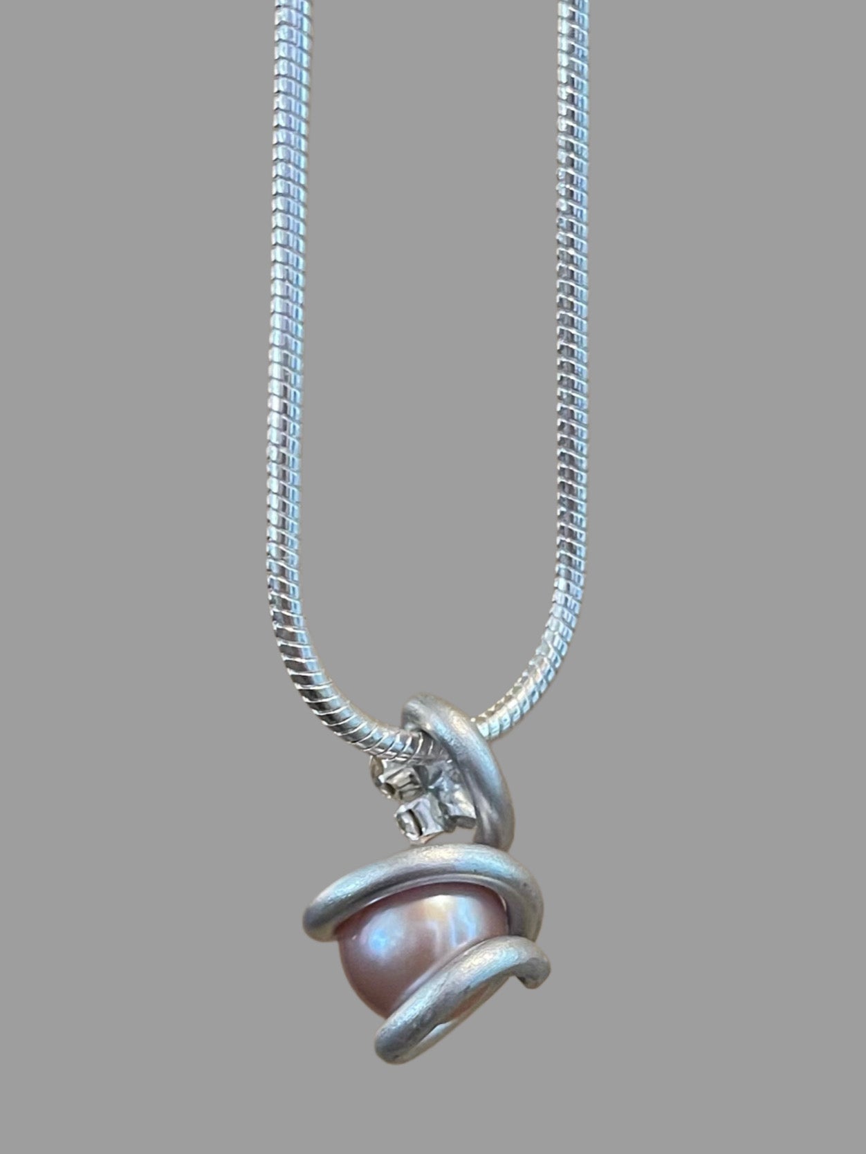 Edison Pearl set in handmade pendant on a 925 Sterling Silver Snake Chain.