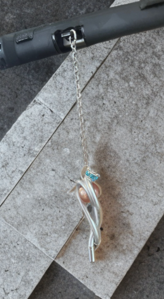Handcrafted Edison Pearl USB-C Charm – Wire Wrapped with Blue Crystal Accent (This Pearl has an unique nacre, the top layer of the pearl)