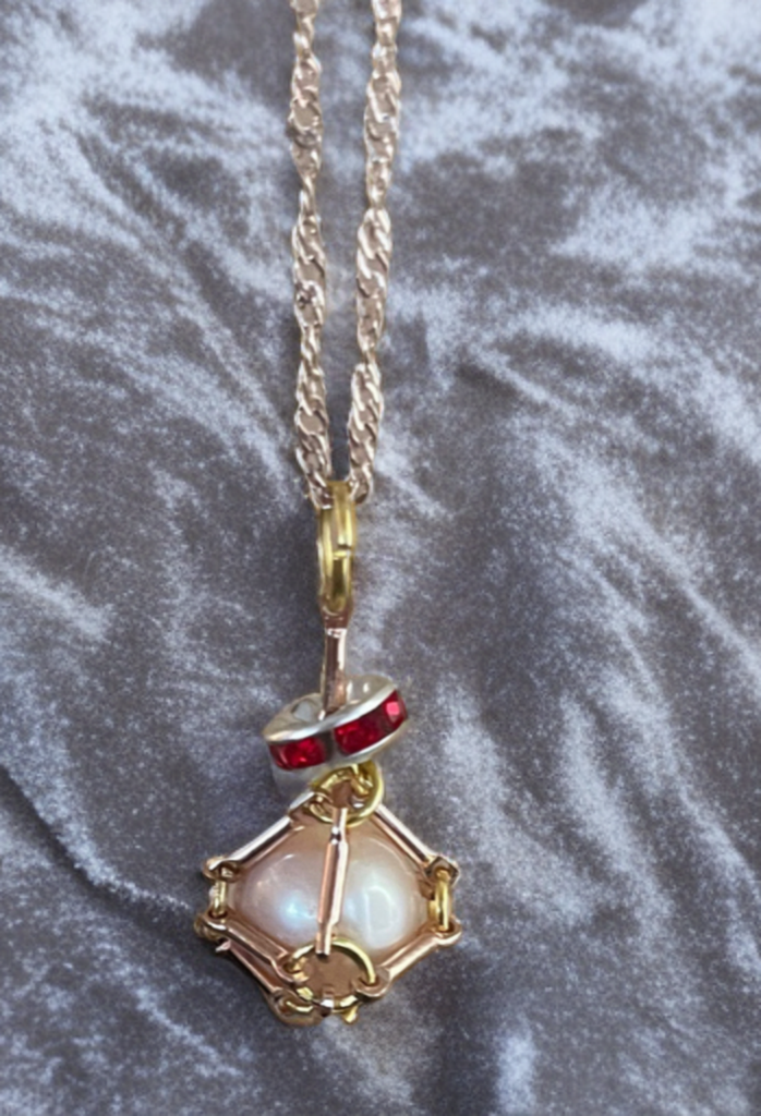 Edison Pearl Necklace in Handmade Brass Cage with Ruby Crystal Accents
