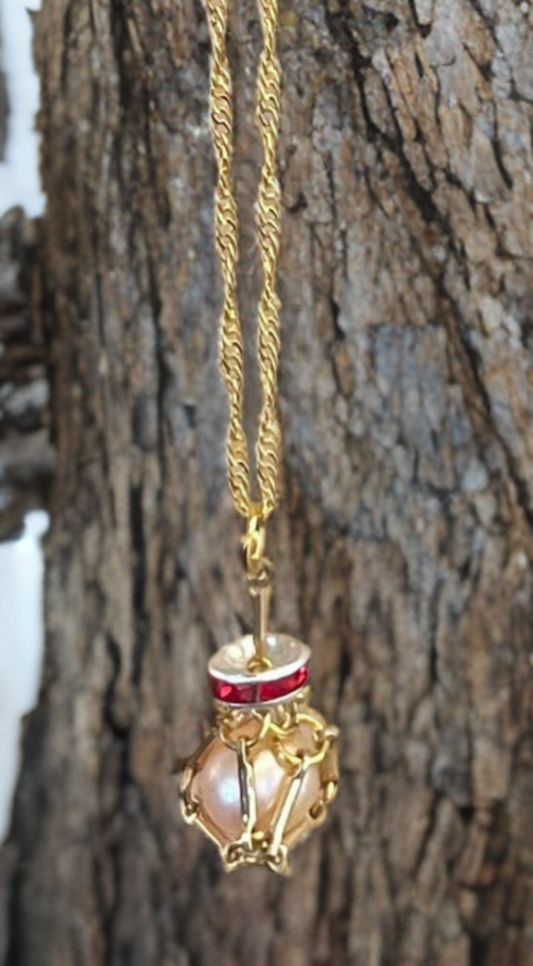 Petite Edison Pearl Necklace in Gold Toned Cage with Ruby Crystal Accent